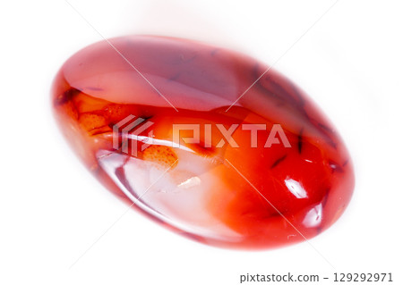 Macro mineral stone Carnelian on white background 129292971