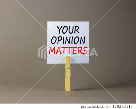 Your opinion matters symbol. Concept words Your opinion matters on beautiful white paper on clothespin. Beautiful grey background. Business your opinion matters concept. Copy space. 129293113