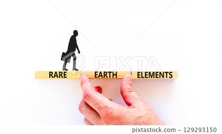 Rare earth elements symbol. Concept words Rare earth elements on beautiful wooden block. Businessman's hand. Beautiful white background. Business and rare earth elements concept. Copy space. Rare earth elements symbol. Concept words Rare earth elements on beautiful wooden block. Businessman's hand. Beautiful white background. Business and rare earth elements concept. Copy space. 129293150