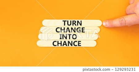 Turn change into chance symbol. Concept words phrase Turn change into chance on beautiful wooden stick. Beautiful orange paper background. Business Turn change into chance concept. Copy space. Turn change into chance symbol. Concept words phrase Turn change into chance on beautiful wooden stick. Beautiful orange paper background. Business Turn change into chance concept. Copy space. 129293231