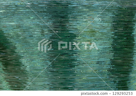 Glass Stacking Side View concept. Glass Factory produces a variety of transparent glass thicknesses. Beautiful typography background. Copy space. Glass Stacking Side View concept. Glass Factory produces a variety of transparent glass thicknesses. Beautiful typography background. Copy space. 129293253