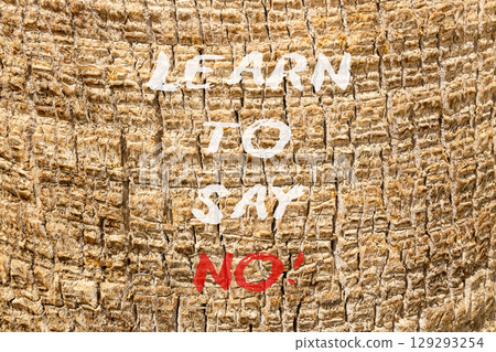 Learn to say no symbol. Concept words phrase Learn to say no on beautiful palm tree bark. Beautiful palm tree bark background. Business psychological Learn to say no concept. Copy space. Learn to say no symbol. Concept words phrase Learn to say no on beautiful palm tree bark. Beautiful palm tree bark background. Business psychological Learn to say no concept. Copy space. 129293254