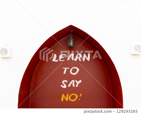 Learn to say no symbol. Concept words phrase Learn to say no on beautiful brown wall. Beautiful white wall background. Business psychological Learn to say no concept. Copy space. 129293265