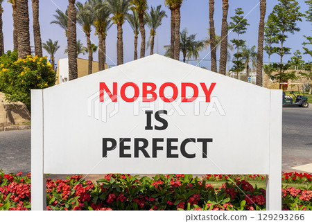 Nobody is perfect symbol. Concept words Nobody is perfect on beautiful white road sign. Beautiful palm tree hotel background. Business motivational lifestyle and nobody is perfect concept. Copy space. Nobody is perfect symbol. Concept words Nobody is perfect on beautiful white road sign. Beautiful palm tree hotel background. Business motivational lifestyle and nobody is perfect concept. Copy space. 129293266