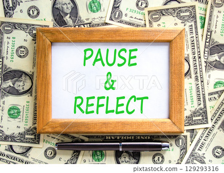 Pause and reflect symbol. Concept words Pause and reflect on beautiful picture frame. Beautiful background from dollar bills. Business motivational lifestyle pause and reflect concept. Copy space. 129293316