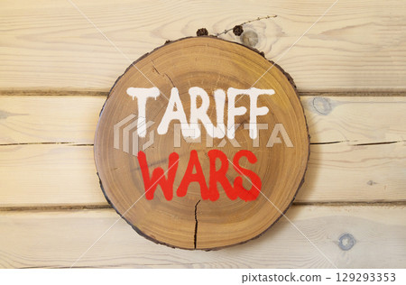 Trade tariff wars symbol. Concept word Tariff wars on beautiful wooden circle on wooden wall. Beautiful wooden wall background. Business trade tariff wars concept concept. Copy space. Trade tariff wars symbol. Concept word Tariff wars on beautiful wooden circle on wooden wall. Beautiful wooden wall background. Business trade tariff wars concept concept. Copy space. 129293353