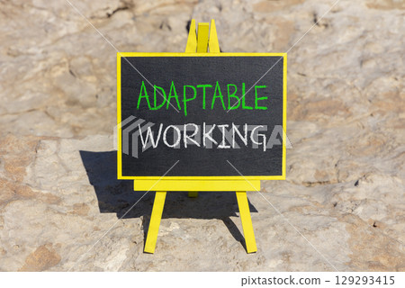 Adaptable working symbol. Concept words Adaptable working on beautiful yellow blackboard. Beautiful red stone beach background. Business Adaptable working concept. Copy space. Adaptable working symbol. Concept words Adaptable working on beautiful yellow blackboard. Beautiful red stone beach background. Business Adaptable working concept. Copy space. 129293415