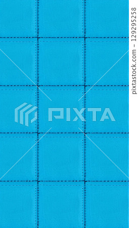 The surface texture of artificial leather is blue, the surface is stitched in the form of diamonds, squares, rectangles. Eco-leather in a kilt.  129295258