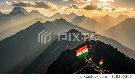 A majestic mountain range is decorated with Indian flags, fluttering proudly at sunset, creating a beautiful and patriotic scene 129295366