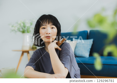 A young woman relaxing at home A young woman relaxing at home 129296781