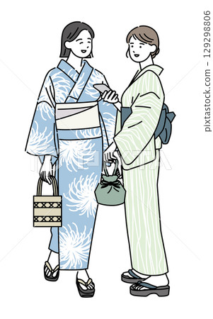 A smiling woman going out with friends in a yukata A smiling woman going out with friends in a yukata 129298806