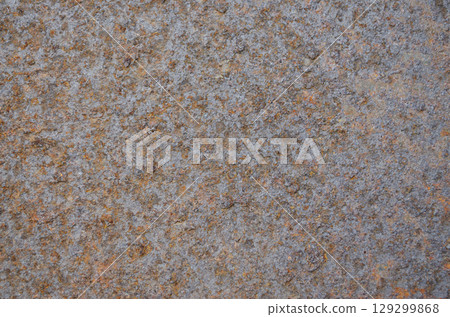 Rusty metal surface with rough corroded orange and gray texture 129299868