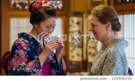 The elegant moment when a woman sips sake in a yukata 129300255