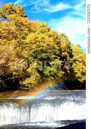 Autumn sweeping waterfall 129300576