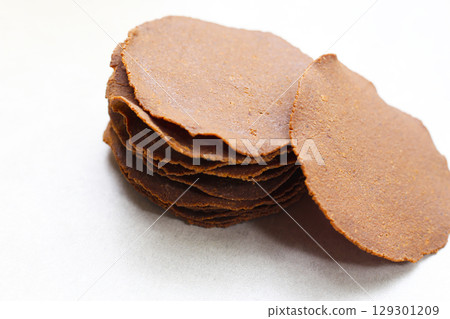 Sun-dried fermented soybean sheets, Thua Nao, a traditional ingredient in Northern Thai cooking. Sun-dried fermented soybean sheets, Thua Nao, a traditional ingredient in Northern Thai cooking. 129301209