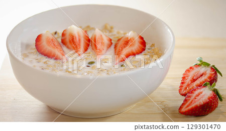 Granola with Milk and Sliced Strawberries for Breakfast 129301470