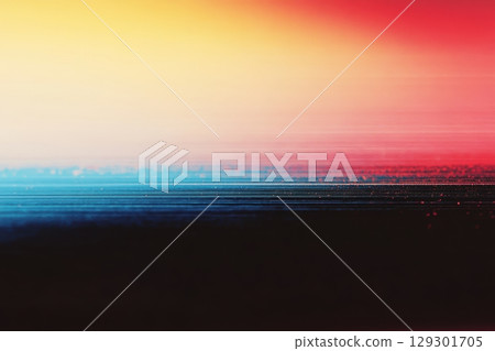 Vibrant sunset blending colors over a calm horizon at the beach 129301705