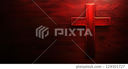 Wooden red cross against a deep red wooden background for spiritual reflection and symbolism 129301727