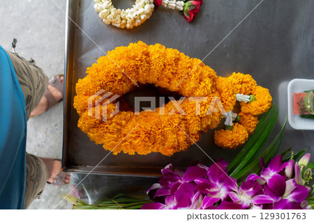 Garland for Worship Displayed at Flower Shop Garland for Worship Displayed at Flower Shop 129301763