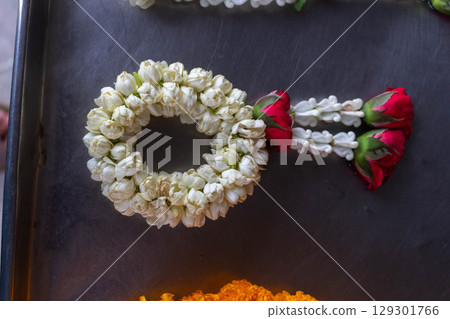 Garland for Worship Displayed at Flower Shop Garland for Worship Displayed at Flower Shop 129301766