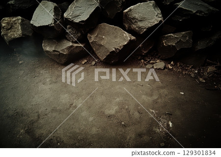 Natural stone textures with dark rocks and sandy ground in a rugged outdoor environment Natural stone textures with dark rocks and sandy ground in a rugged outdoor environment 129301834