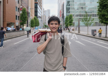 Portrait of a smiling man shopping in Ginza Portrait of a smiling man shopping in Ginza 129301864
