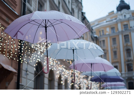 Romantic Rainy Street with Colorful Umbrellas and Festive Lights 129302271