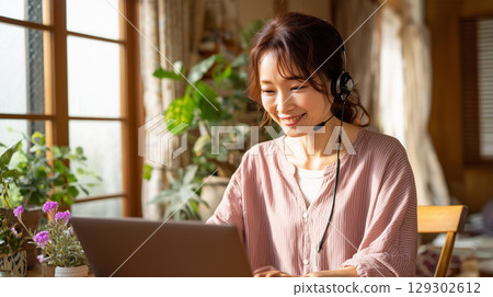 Japanese woman teleworking from home Japanese woman teleworking from home 129302612
