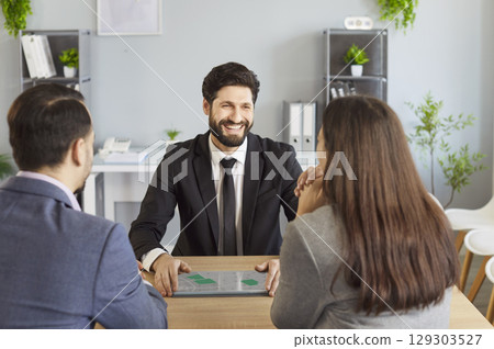 Business meeting of clients couple with professional financial advisor and expert in office Business meeting of clients couple with professional financial advisor and expert in office 129303527