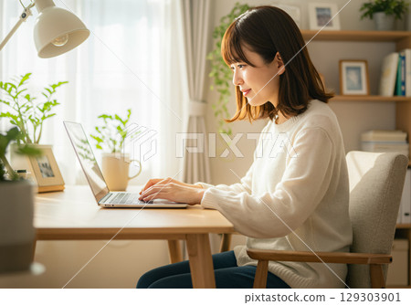 Young woman working calmly at home Young woman working calmly at home 129303901