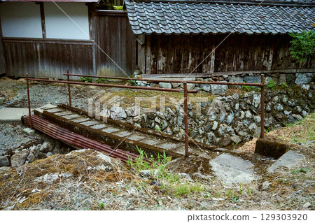 A small bridge behind the house 129303920