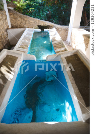 Authentic Outdoor Lavajo with White Concrete Structure in a Natural Setting 129304231