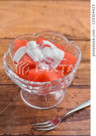 Sliced watermelon with yogurt 129304423