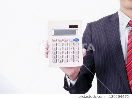 Businessman showing a calculator 129304475