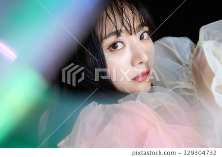 Luxury beauty fashion portrait of young woman in dress on dark background 129304732