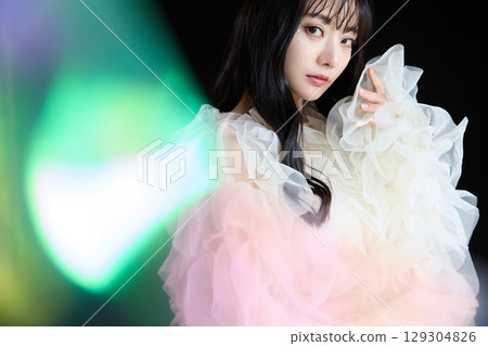 Luxury beauty fashion portrait of young woman in dress on dark background 129304826
