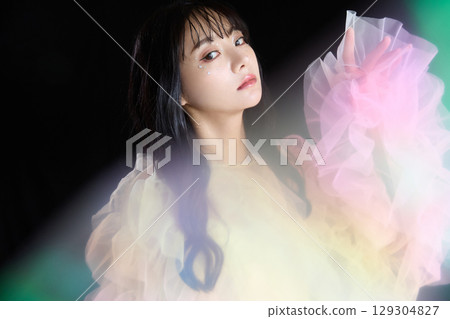 Luxury beauty fashion portrait of young woman in dress on dark background 129304827