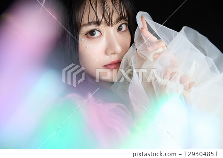 Luxury beauty fashion portrait of young woman in dress on dark background 129304851