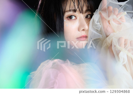 Luxury beauty fashion portrait of young woman in dress on dark background 129304868