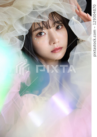 Luxury beauty fashion portrait of young woman in dress on dark background 129304870