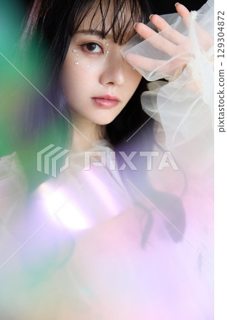 Luxury beauty fashion portrait of young woman in dress on dark background 129304872