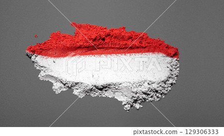 Closeup view of the red and white colors of the Indonesian national flag with a black wall background. Celebrate Indonesia Independence Day. Concept of Kemerdekaan Indonesia 129306333