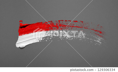 Closeup view of the red and white colors of the Indonesian national flag with a black wall background. Celebrate Indonesia Independence Day. Concept of Kemerdekaan Indonesia 129306334