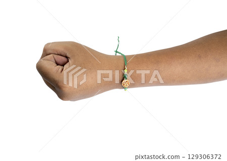 Human hand showing colorful rakhis on the wrist, isolated over a white background, celebrating the bond of love and protection. Concept of the Raksha Bandhan festival 129306372