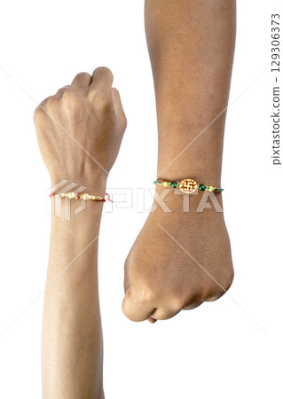 Human hands showing colorful rakhis on the wrist, isolated over a white background, celebrating the bond of love and protection. Concept of the Raksha Bandhan festival Human hands showing colorful rakhis on the wrist, isolated over a white background, celebrating the bond of love and protection. Concept of the Raksha Bandhan festival 129306373