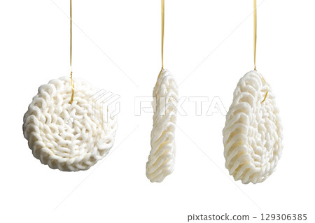 Set of kerupuk crackers hanging on the rope for games to celebrate Indonesia Independence Day isolated over a white background. Concept of Kemerdekaan Indonesia Set of kerupuk crackers hanging on the rope for games to celebrate Indonesia Independence Day isolated over a white background. Concept of Kemerdekaan Indonesia 129306385