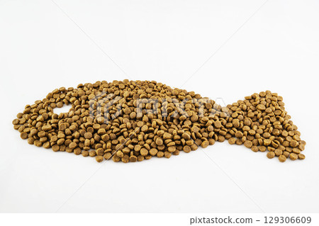 Dog and cat dry food splattered isolated over a white background Dog and cat dry food splattered isolated over a white background 129306609