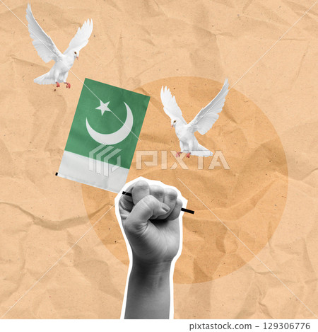 Human hand holding the Pakistan national flag with a flying pigeon bird. Concept of Pakistan Independence Day. Collage art 129306776