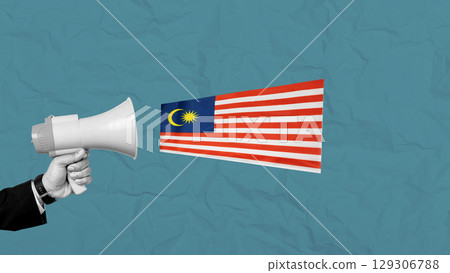 Human hand holding a megaphone showing the Malaysian flag to celebrate Malaysia Independence Day. Collage art 129306788