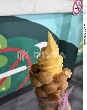 Crispy, golden waffles topped with creamy ice cream, creating a perfect balance of warm and cold, crunchy and smooth. A delightful dessert or breakfast treat, made even better with toppings like Crispy, golden waffles topped with creamy ice cream, creating a perfect balance of warm and cold, crunchy and smooth. A delightful dessert or breakfast treat, made even better with toppings like 129307126